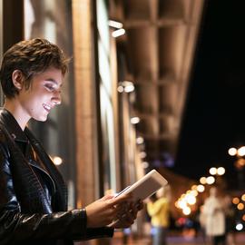 Medium-shot-woman-holding-tablet